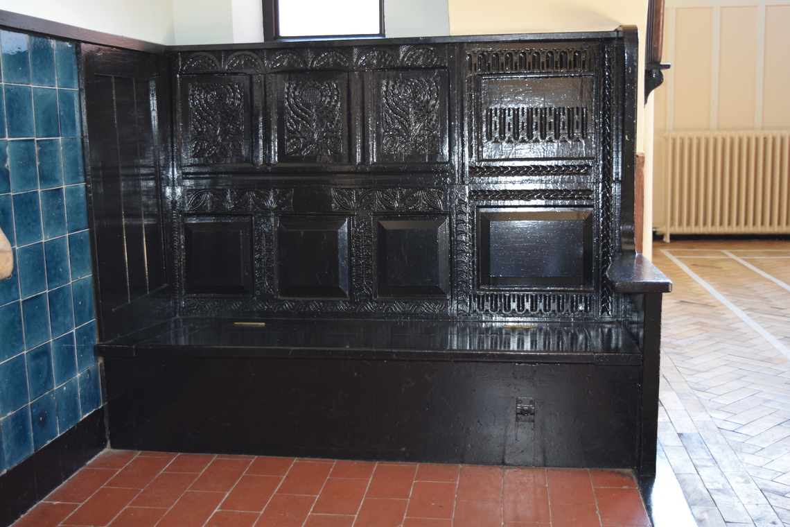 Village Hall Carved Bench in Fireplace